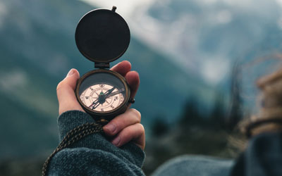 Hiker holding compass